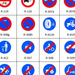 Variedad de señales de tráfico, incluyendo la señal R120 que prohíbe el paso a vehículos de motor.