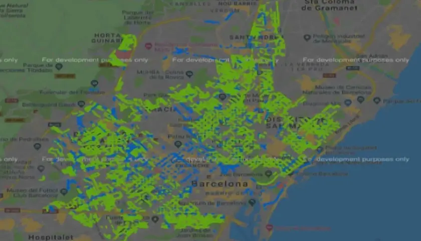 Mapa de Barcelona con áreas de zone bleu resaltadas en verde y azul. Muestra distritos como Gràcia, Eixample y Sant Andreu.